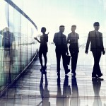 Silhouettes of Business People in Blurred Motion Walking